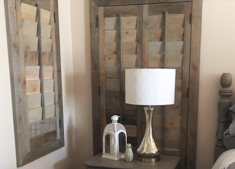 Charlotte bedroom with reclaimed wood shutters.